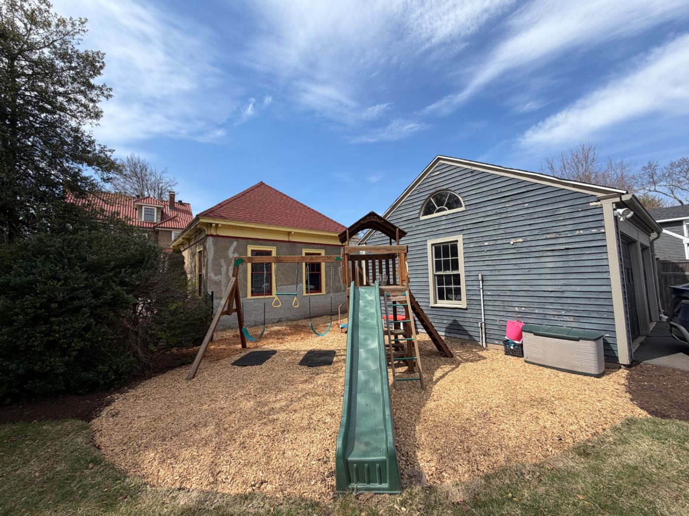 Backyard play area with wood-chip ground covering